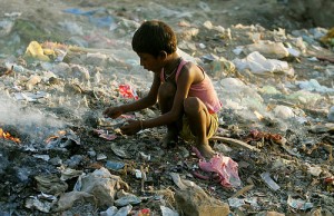 Child searches for valuables in a garbage dump in New Delhi