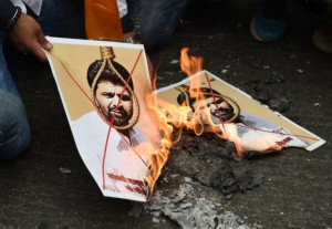 Activists of Indian right-wing Hindu organization Hindu Sena burn photographs of Yakub Memon, a key plotter of the Mumbai bomb attacks which killed hundreds of people in 1993, during a protest demanding capital punishment for him in New Delhi on July 29, 2015.  India's top court has rejected a final appeal by Yakub Memon, a key plotter of bomb attacks that killed hundreds in Mumbai in 1993, paving the way for his execution.  Media reports said Yakub Memon would hang on July 30 -- more than two decades after the deadliest attacks ever to hit India -- after the Supreme Court rejected his final plea.  AFP PHOTO / SAJJAD HUSSAIN